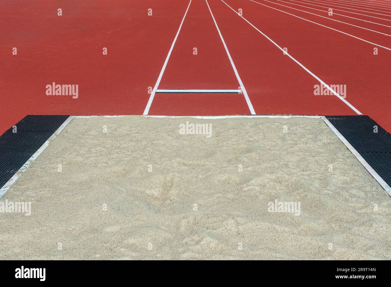 Long jump pit in a stadium. Horizontal sport theme poster, greeting