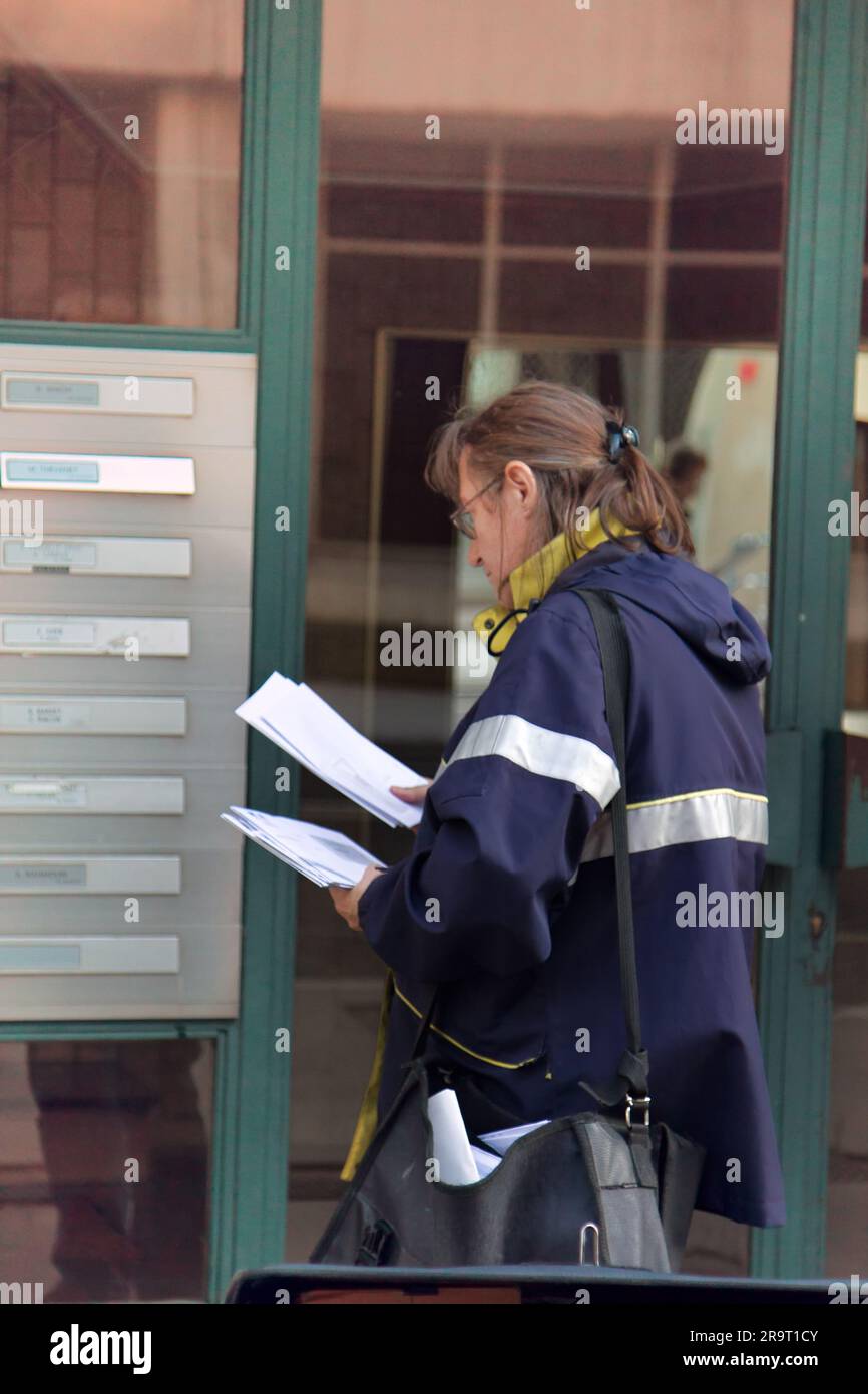 Lyon, France October 14, 2017 Postman (postwoman, woman letter
