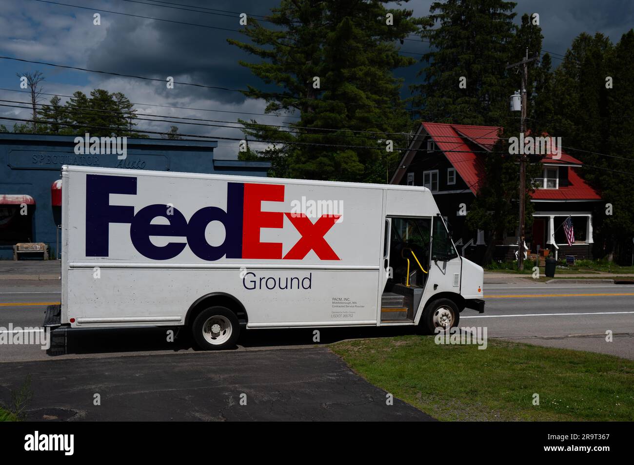 A white FedEx Ground truck in front of a residence in Speculator, NY to deliver packages. Stock Photo