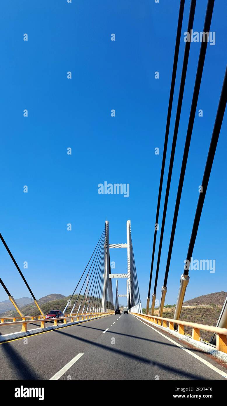 Acapulco, Guerrero, Mexico - Apr 28 2023: The Mezcala Solidaridad Bridge is a cable-stayed bridge over the Balsas River on the Autopista del Sol Stock Photo