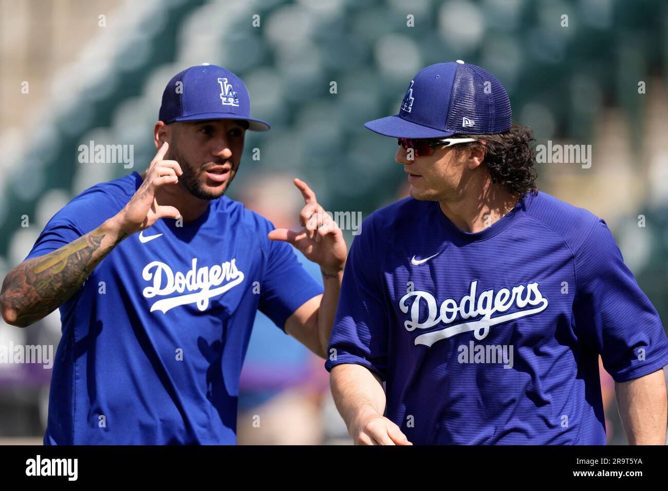 Los Angeles Dodgers left fielder David Peralta, left, jokes with center  fielder James Outman before the team's baseball game against the Colorado  Rockies on Wednesday, June 28, 2023, in Denver. (AP Photo/David