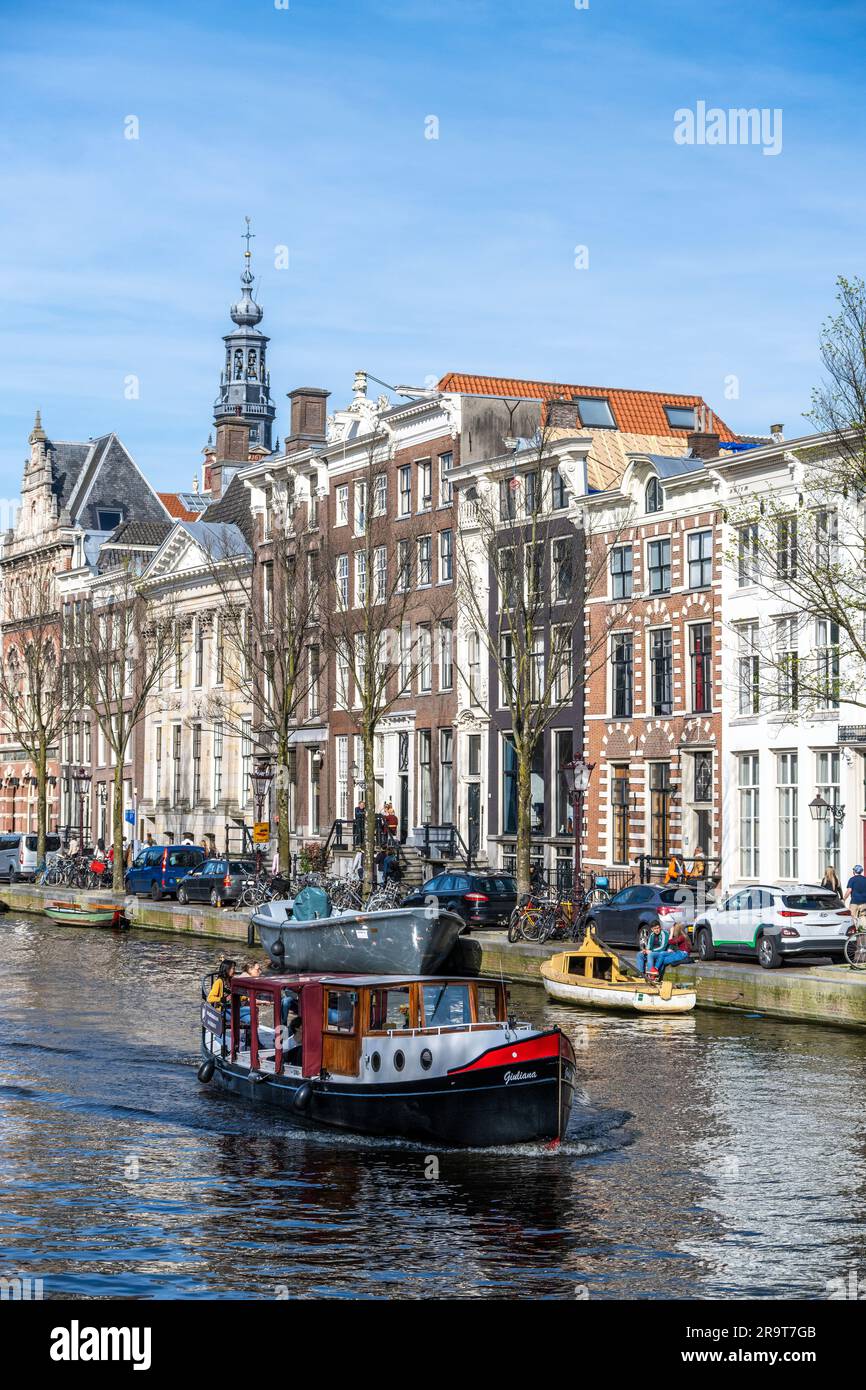 tourists and locals enjoying a sunny day in Amsterdam Stock Photo