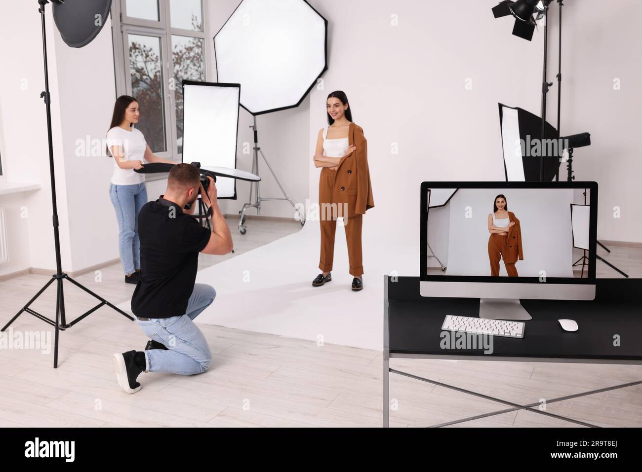 Photographer Using Model Young female photographer setting hi-res stock photography and images ...