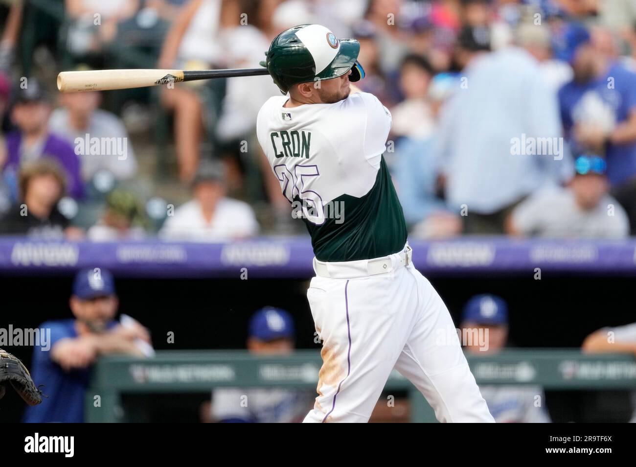 Colorado Rockies' C.J. Cron follows the flight of his RBI-single against  Los Angeles Dodgers starting pitcher Michael Grove in the third inning of a  baseball game Wednesday, June 28, 2023, in Denver. (