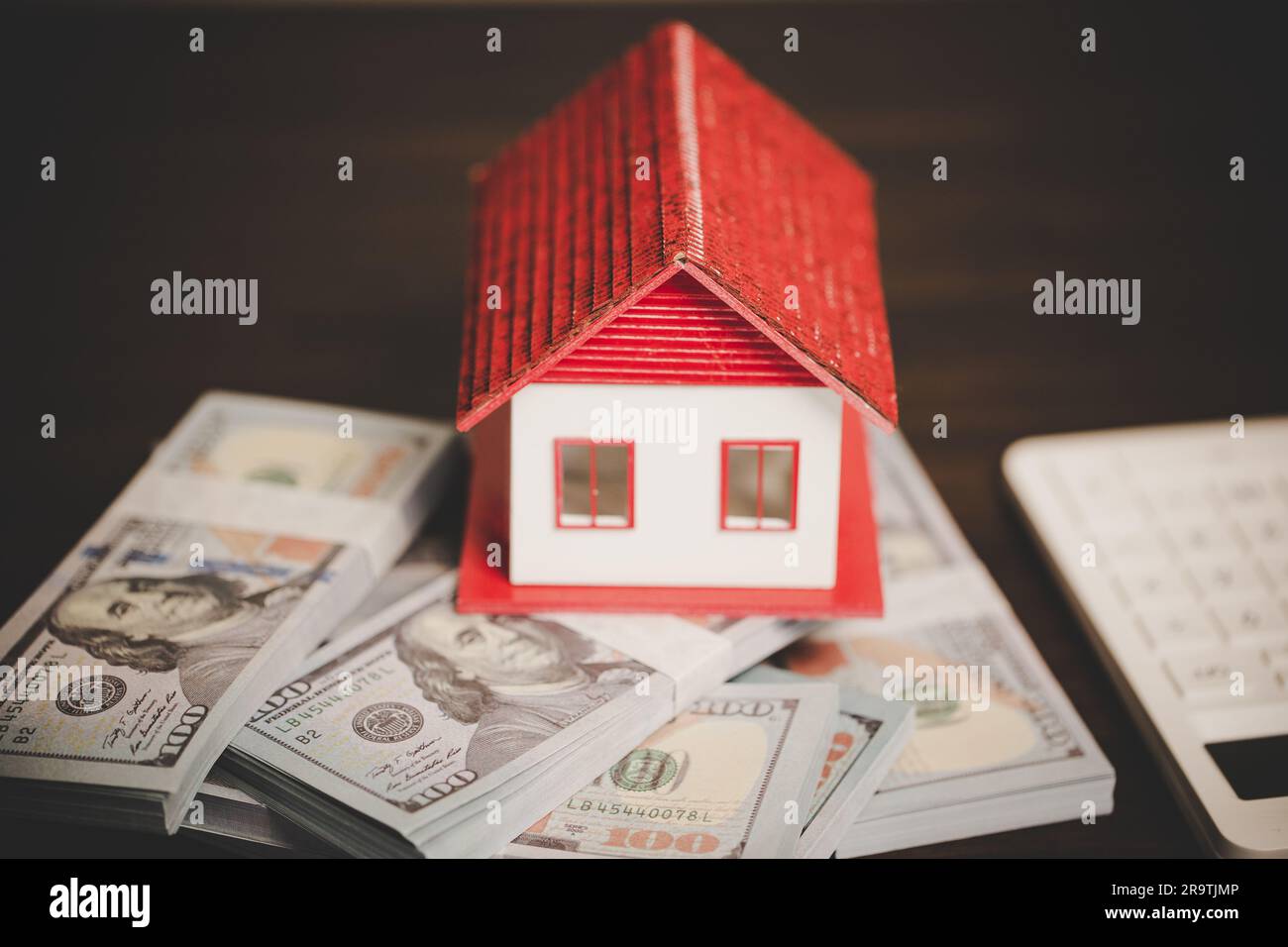 house property mortgage with cash money dollar bill on table concept of