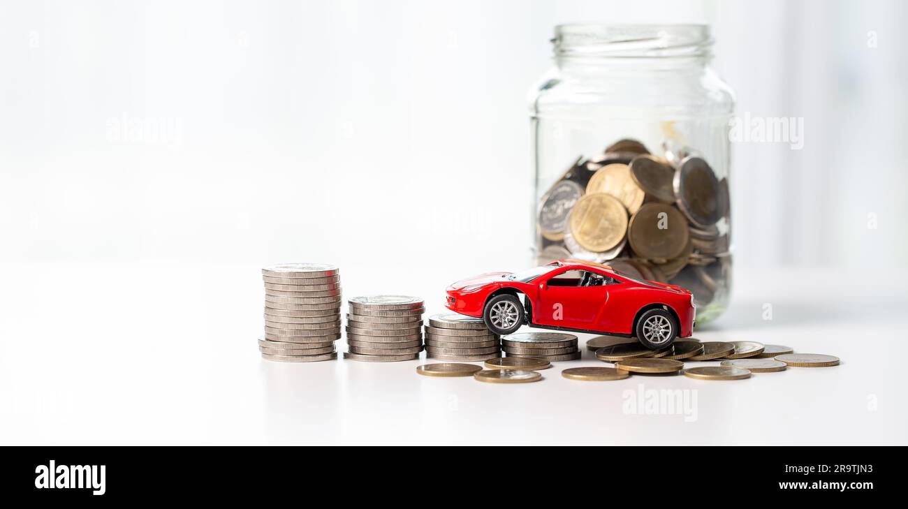 Car toy vehicle with stack coin money on background. Planning to manage transportation finance
