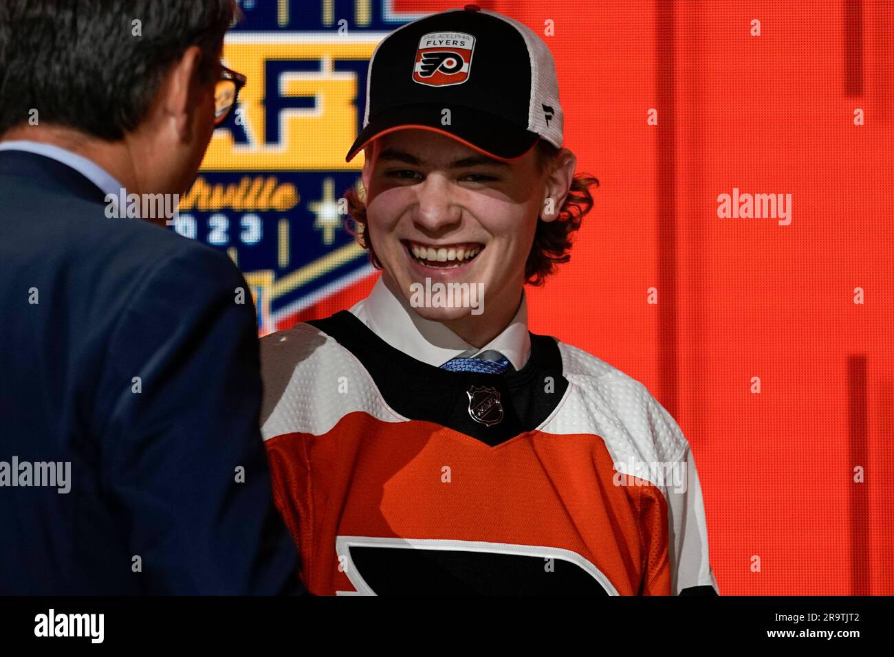Oliver Bonk smiles on stage after being picked by the Philadelphia