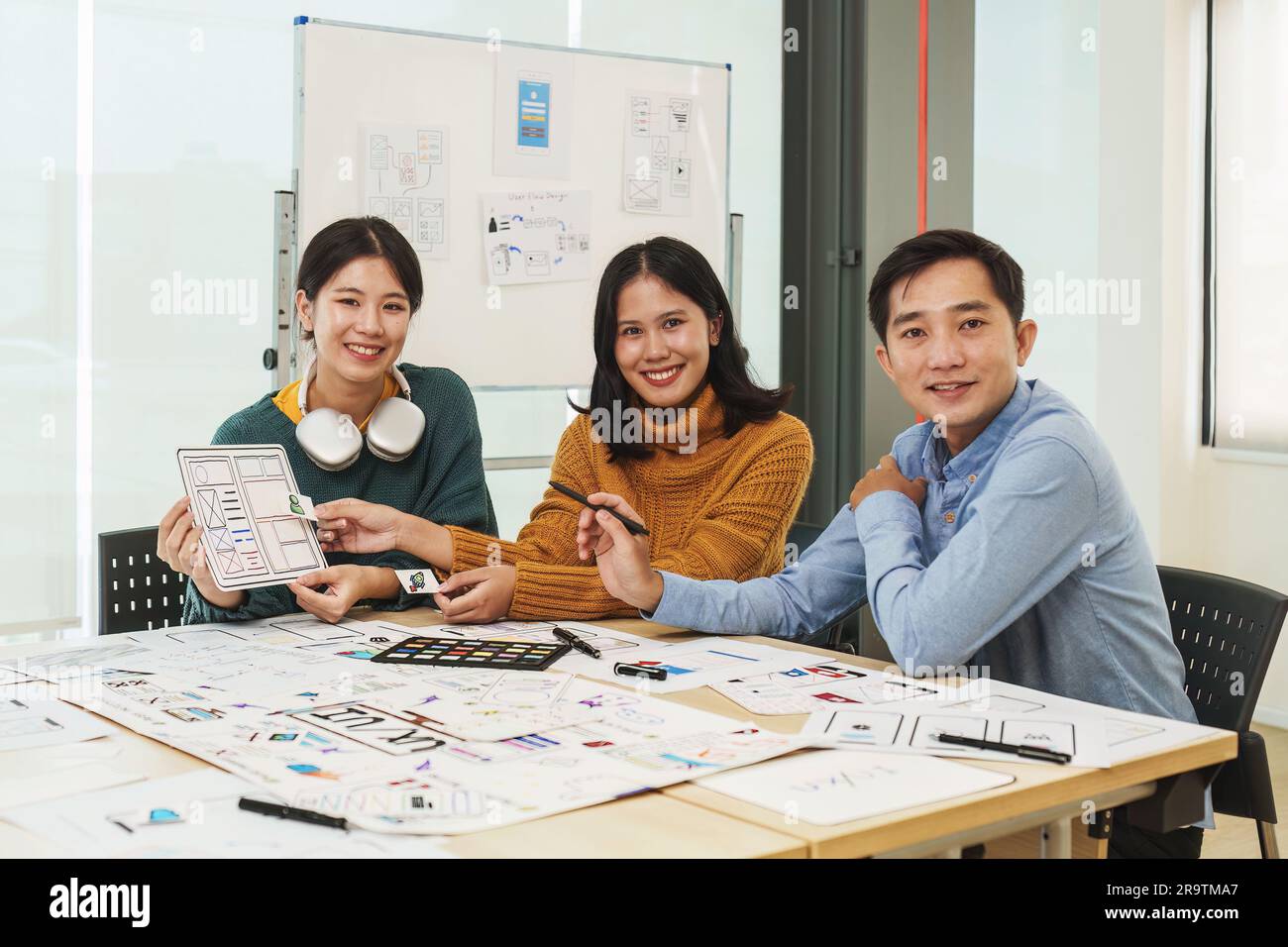 Team of ux developer and ui designer brainstorming interface wireframe ...