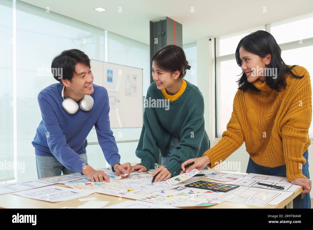 Team of ux developer and ui designer brainstorming interface wireframe ...