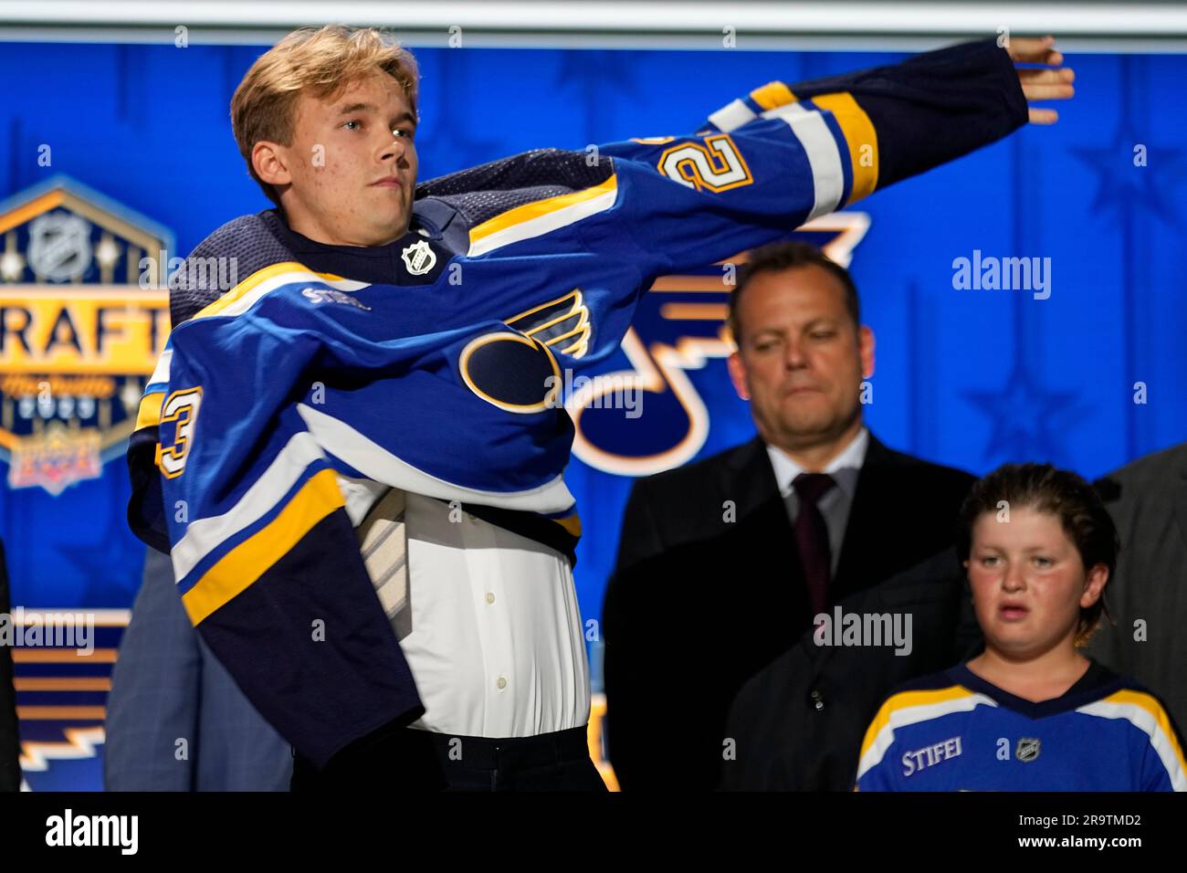 Theo Lindstein puts on a St. Louis Blues jersey after being picked by the  team during the first round of the NHL hockey draft Wednesday, June 28,  2023, in Nashville, Tenn. (AP
