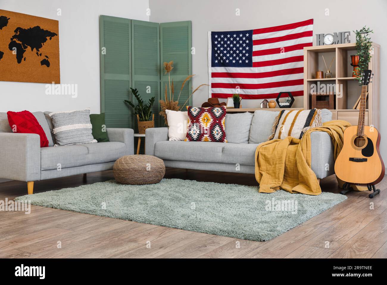 Interior of stylish living room with hanging USA flag Stock Photo - Alamy