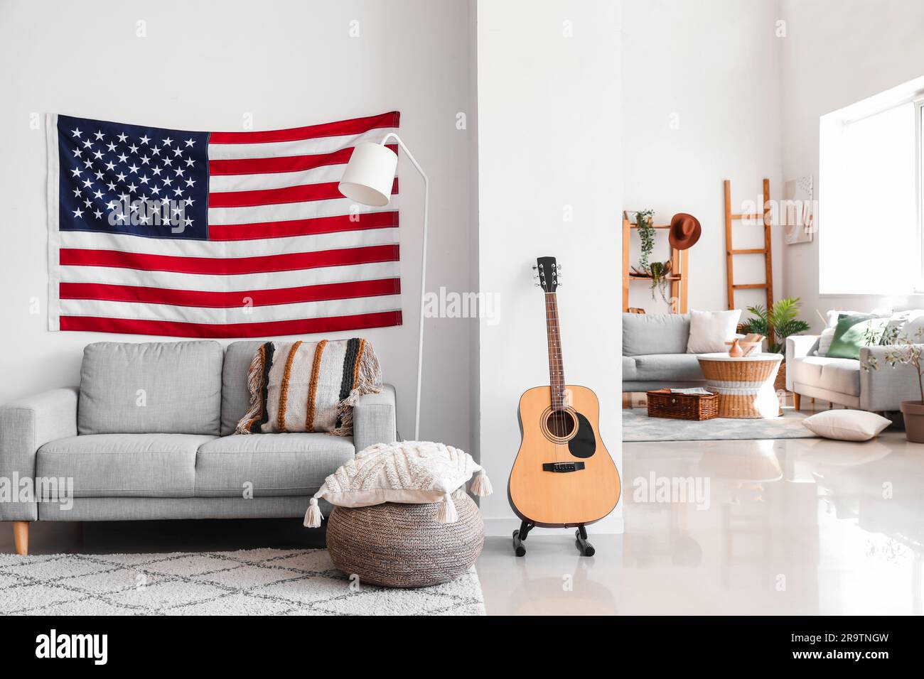 Interior of modern living room with hanging USA flag Stock Photo - Alamy
