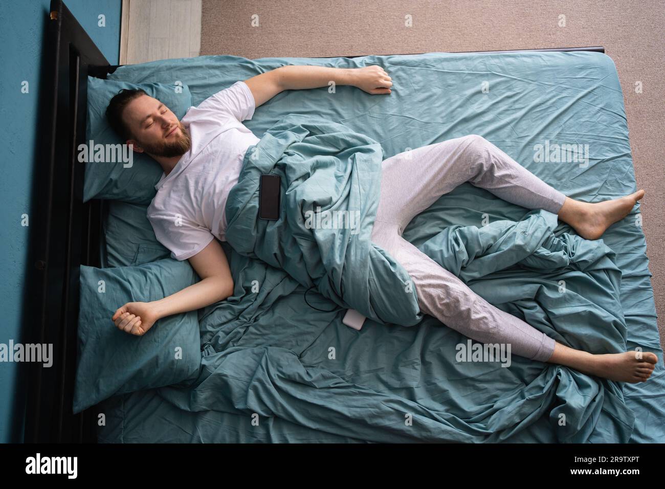 Spread out in bed hi-res stock photography and images - Alamy
