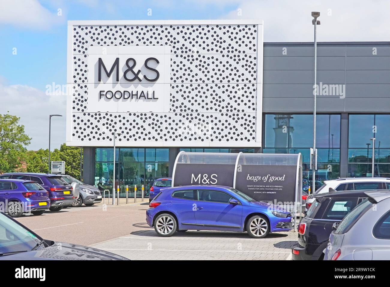 M&S foodhall modern architecture shop front Marks and Spencer in retail park food hall shopping & customer trolley shelter Chelmsford Essex England UK Stock Photo