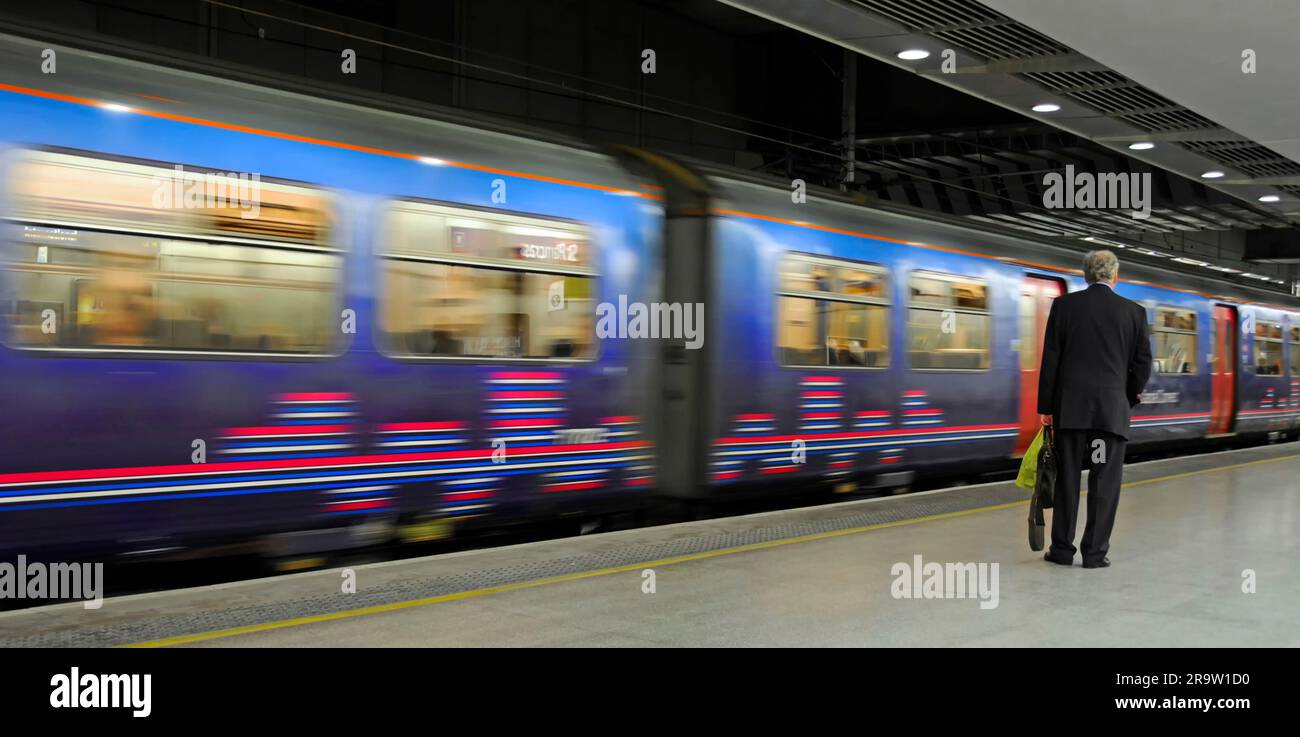 Motion blur of First Capital Connect train & platform at St Pancras International low level station serving Thameslink services London England UK Stock Photo