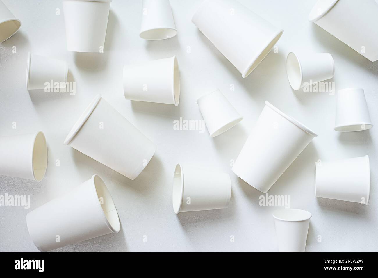 Paper coffee cups different sizes layout, monochrome image Stock Photo