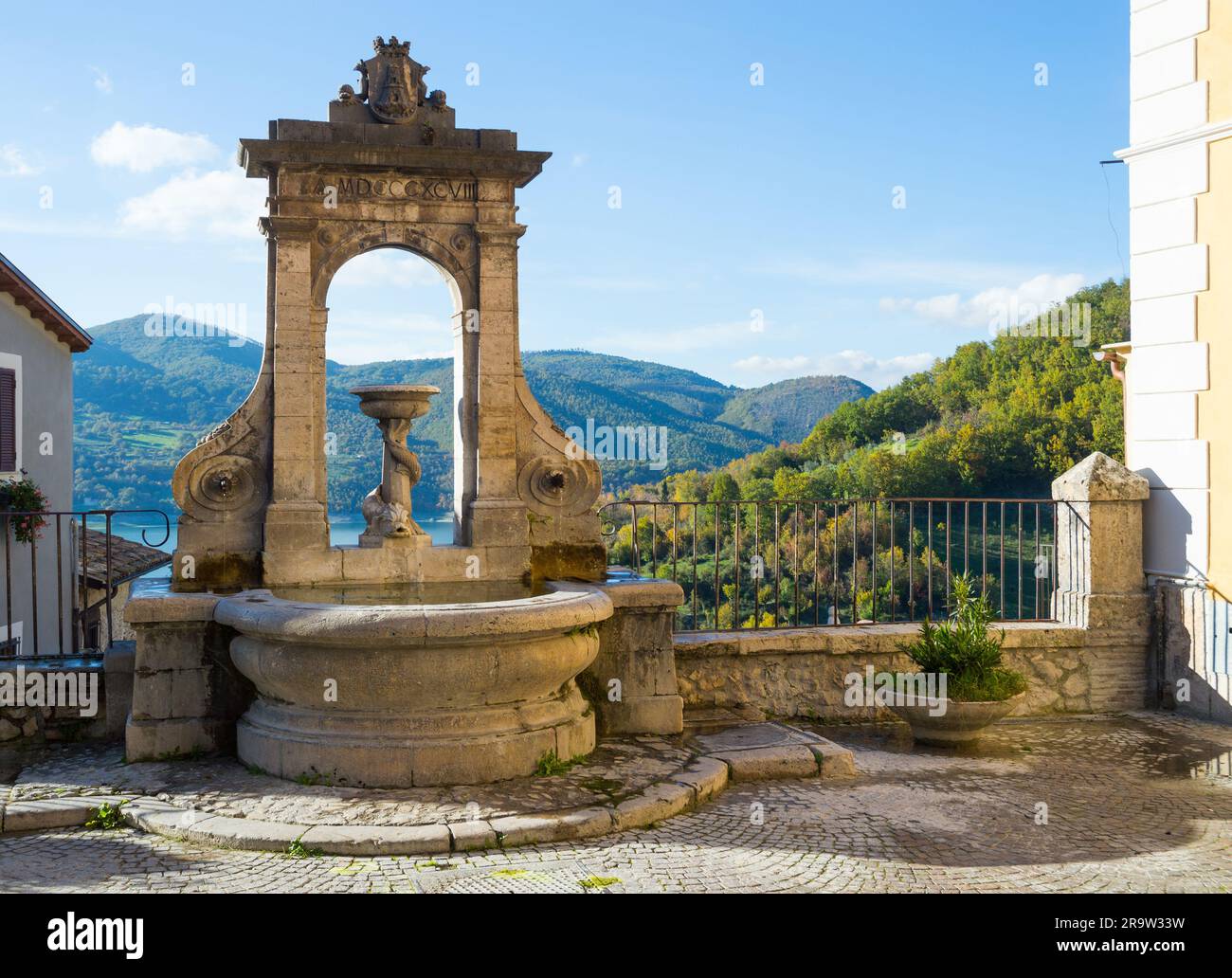 Fontana del Tritone in Castel di Tora with Lake Turano, beautiful village in the Province of Rieti. Lazio, Italy. Stock Photo