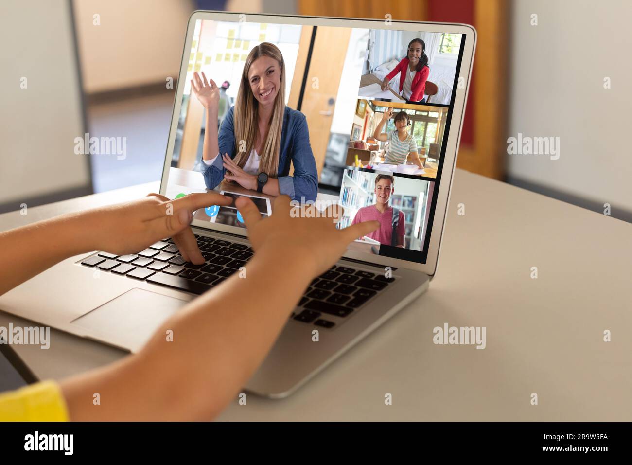 Diverse female teacher and students having laptop video call Stock ...