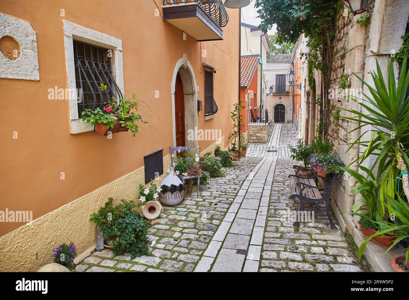 A street among the characteristic houses of Buonalbergo, a village in the mountains in the province of Benevento Stock Photo