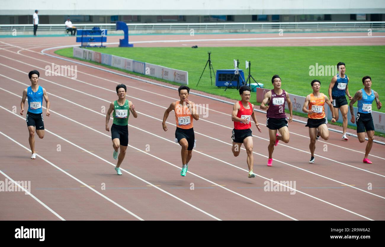 SHENYANG, CHINA - JUNE 29, 2023 - Runners compete in the men's 200m race during the Hangzhou Asian Games trials in Shenyang, Liaoning province, China, Stock Photo