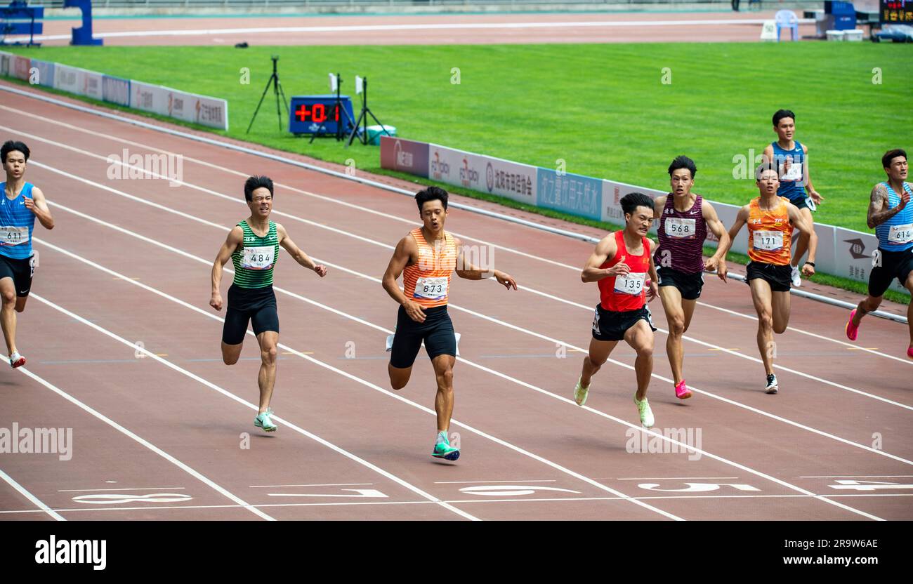 SHENYANG, CHINA - JUNE 29, 2023 - Runners compete in the men's 200m race during the Hangzhou Asian Games trials in Shenyang, Liaoning province, China, Stock Photo