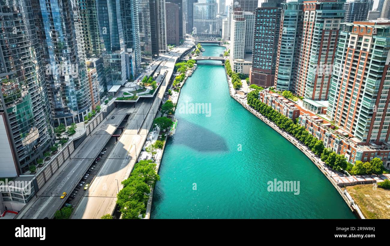 Chicago River at downtown with its iconic buildings around aerial