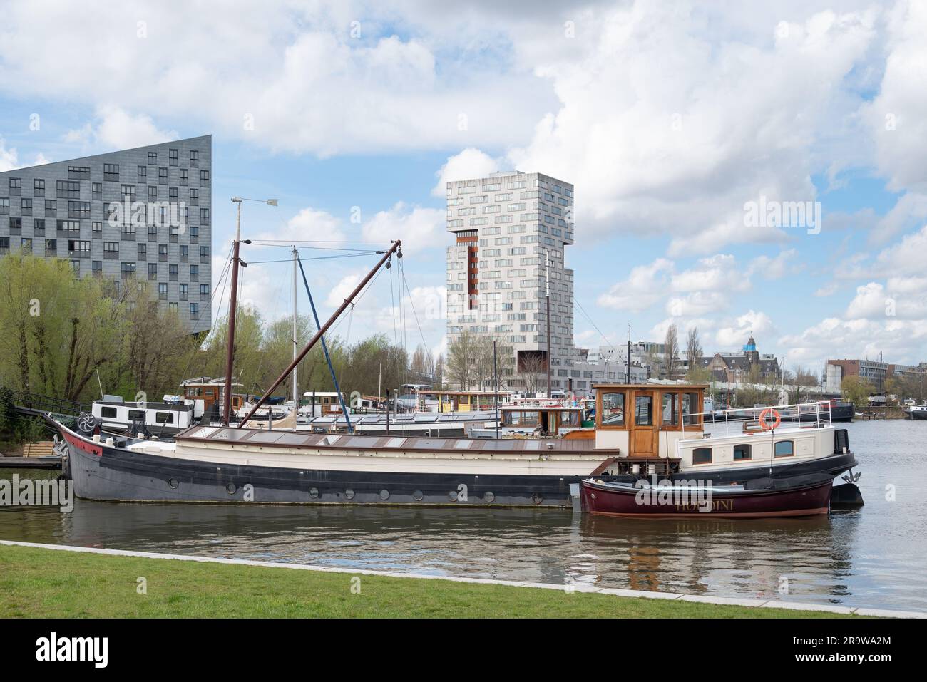 Amsterdam, Netherlands - Ij-Toren housing tower by Neutelings Riedijk across Ijhaven with boats Stock Photo