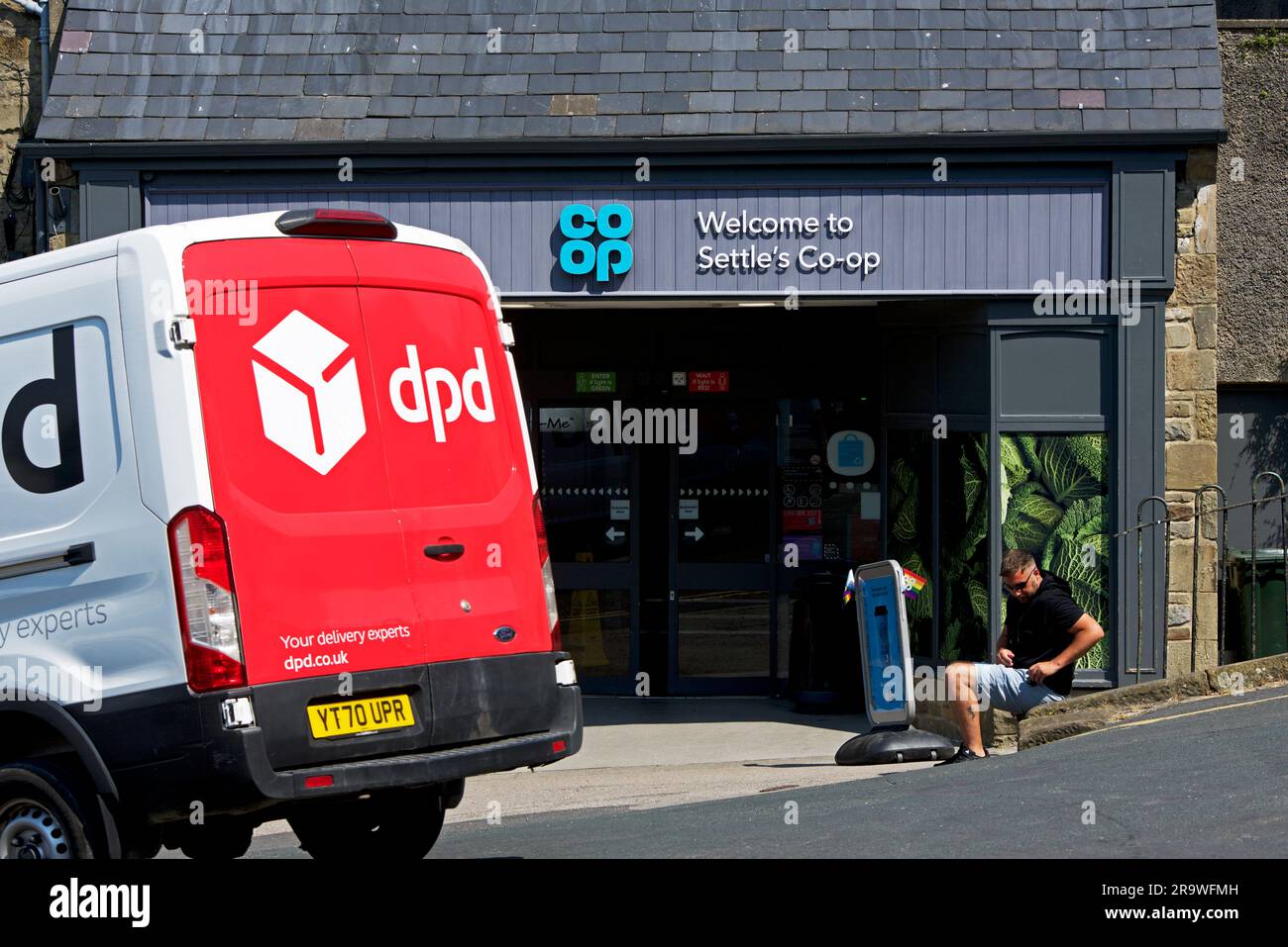 DPD delivery van outside the Coop, in the market-place, Settle, North Yorkshire, England UK Stock Photo