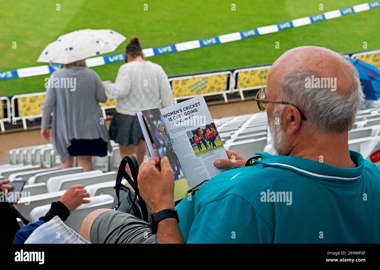 Senior man reading programme, during women's Ashes, June 2023, at Trent Bridge Cricket Ground, Nottingham, Nottinghamshire, England UK Stock Photo
