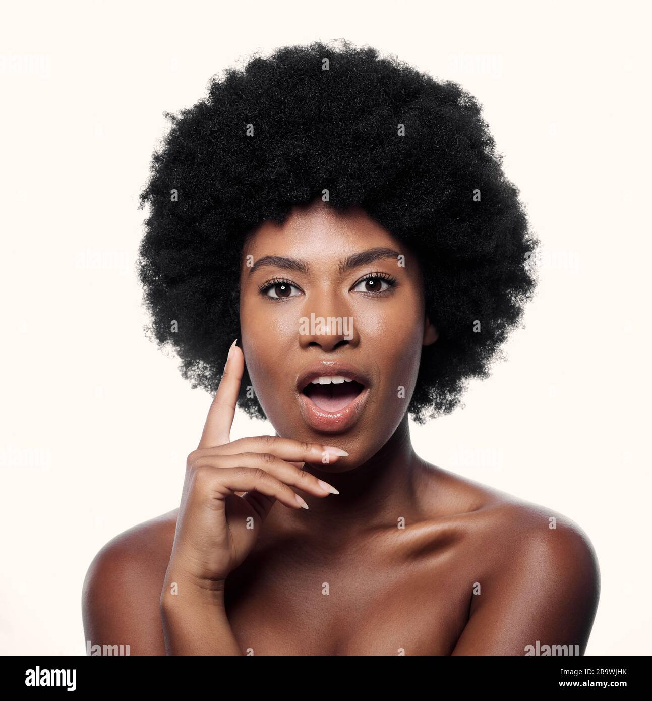 Natural beauty, surprise and portrait of black woman with afro
