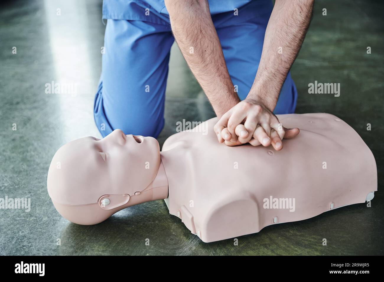 Person doing chest compressions on hi-res stock photography and images ...