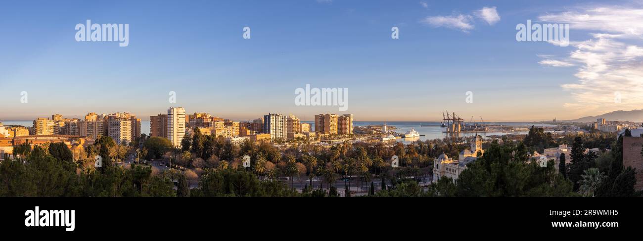 A panoramic view on the La Malagueta district during sunset with the  Muelle Uno district in Malaga, Spain Stock Photo