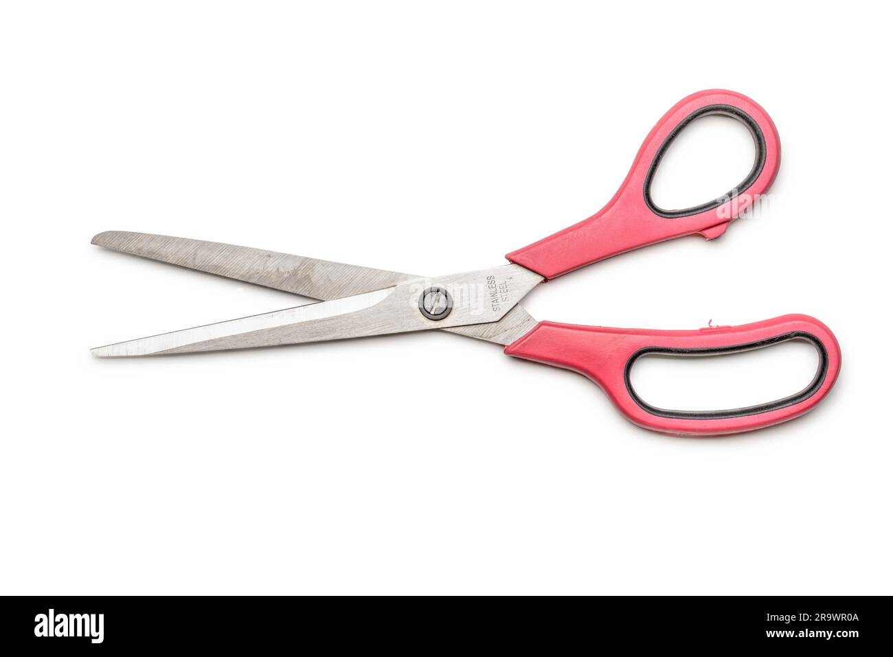 Modern scissors with pink handle isolated on white background Stock Photo
