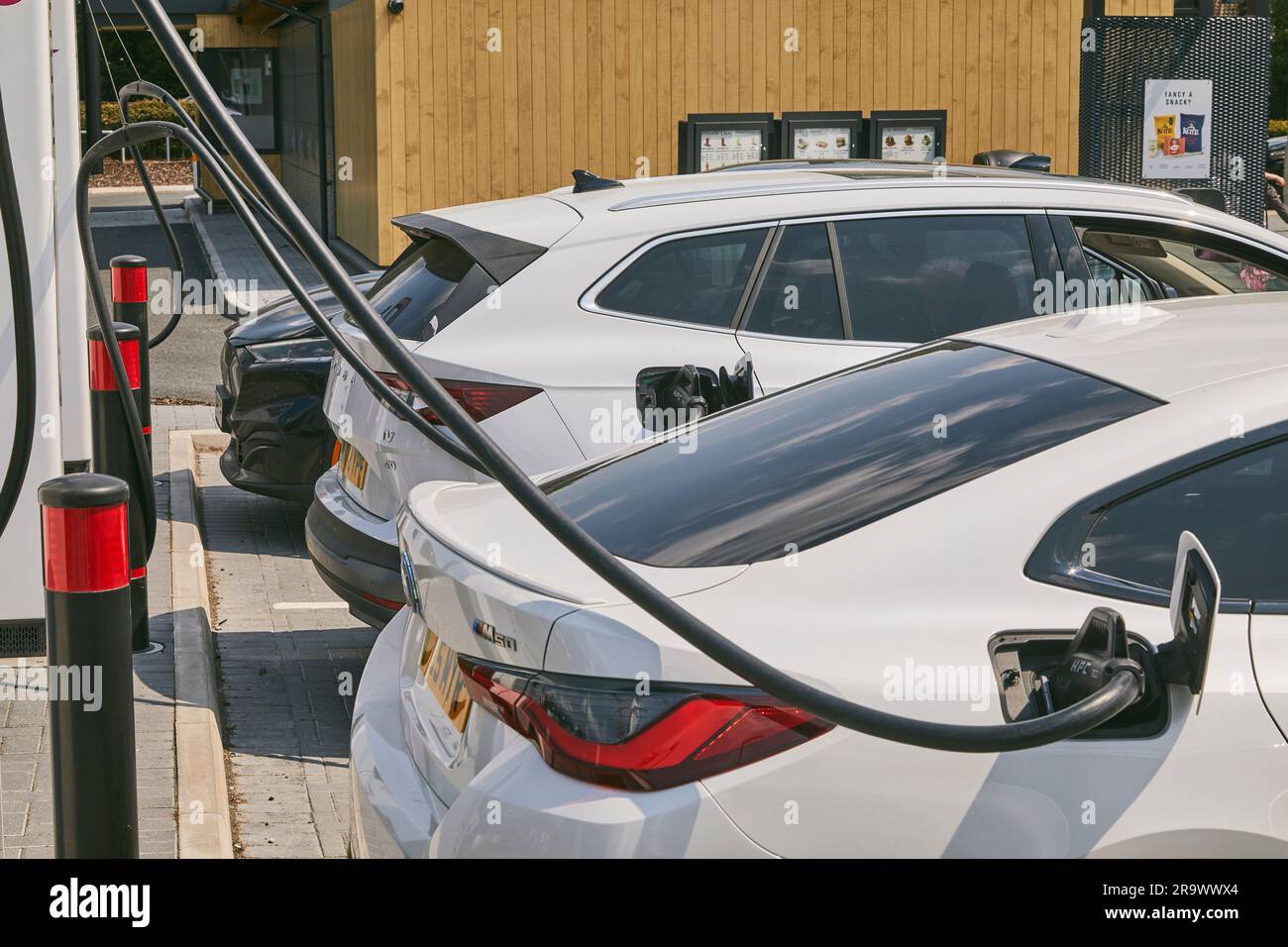The future is here electric vehicles charging at an electric vehicle (EV) charging station