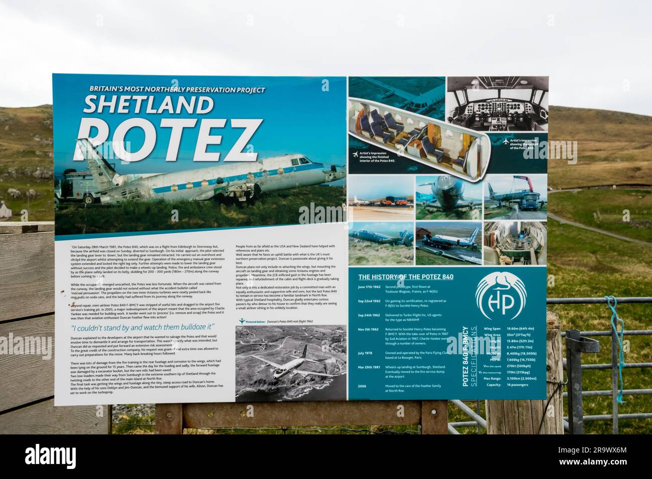 Interpretive sign with tourist information about the Potez 840 aircraft fuselage in the garden of a house at North Roe, Shetland. Stock Photo