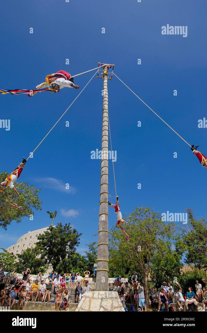 Papantla Flying Men, hanging upside down in the air, Xcaret Eco Park, near Playa del Carmen, Riviera Maya, Quintana Roo, Yucatan, Mexico, Yucatan Stock Photo
