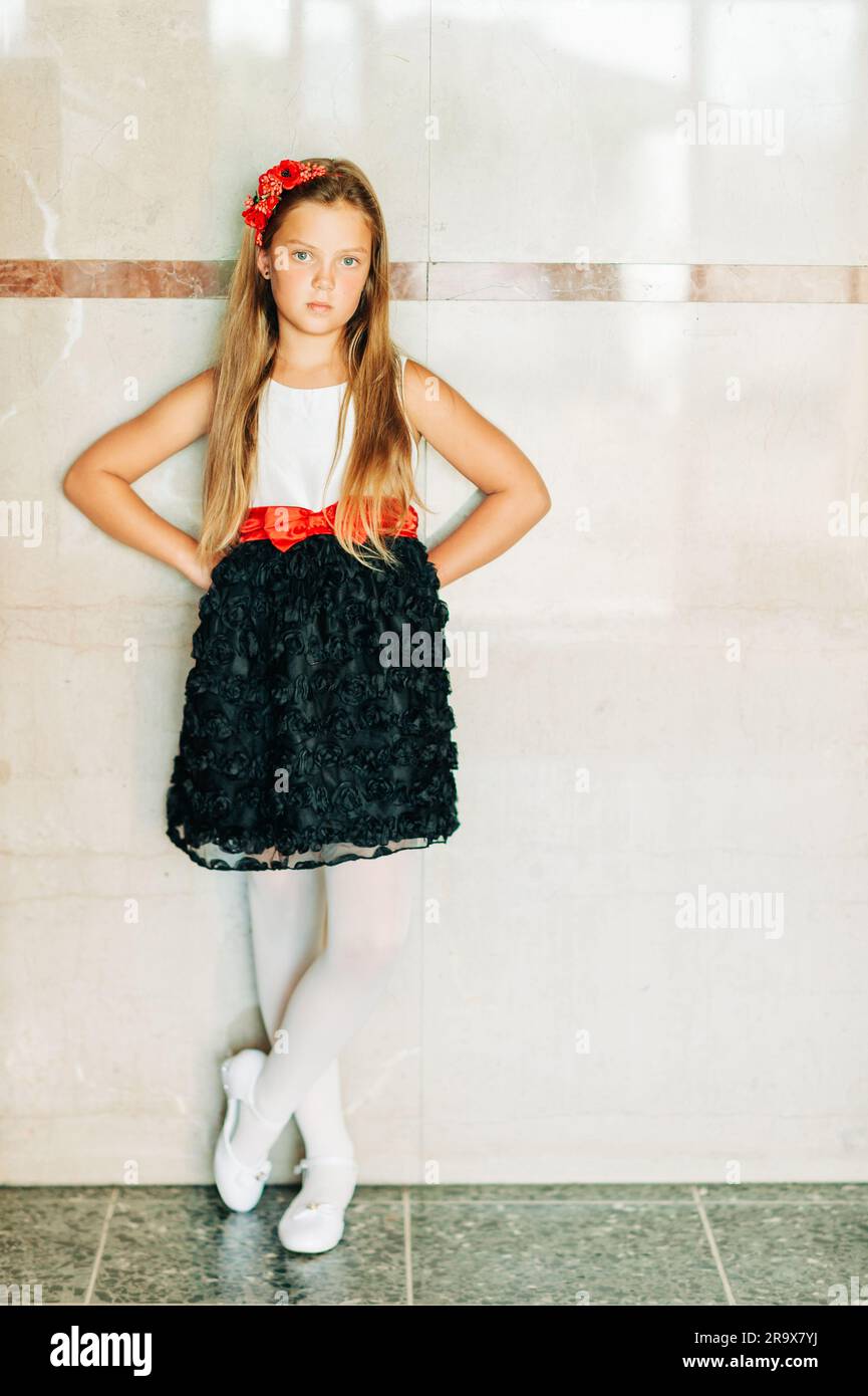Portrait of young girl model wearing black and white roses dress with red belt Stock Photo - Alamy Portrait of young girl model wearing black and white roses dress with red belt Stock Photo - Alamy