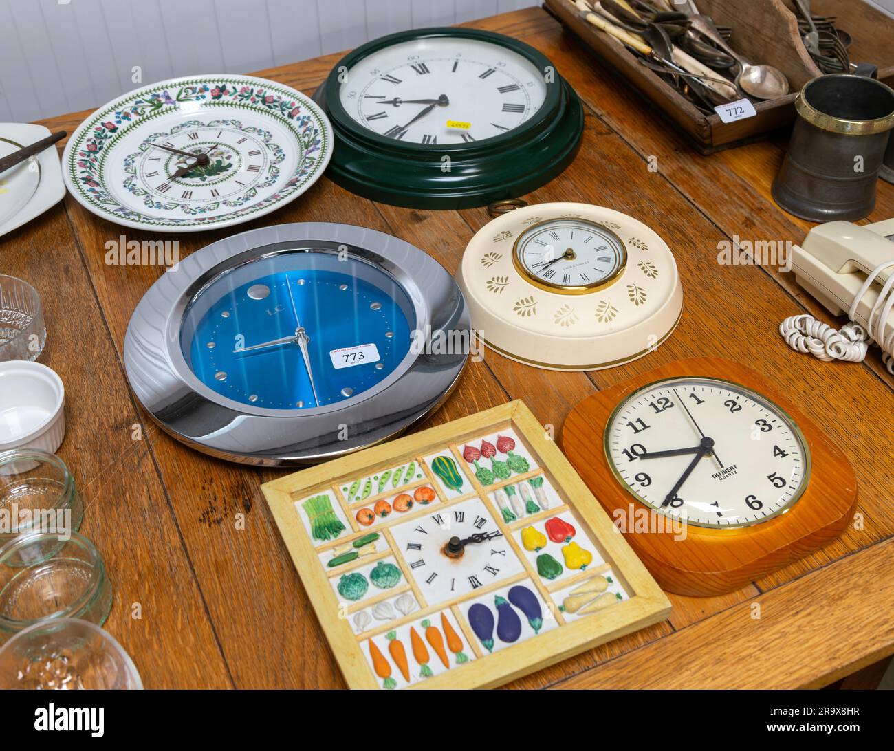 A selection of clocks on display in auction room, UK Stock Photo Alamy