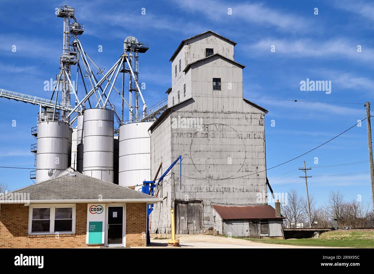 Earlville, Illinois, USA. Grain elevators complex beside railroad