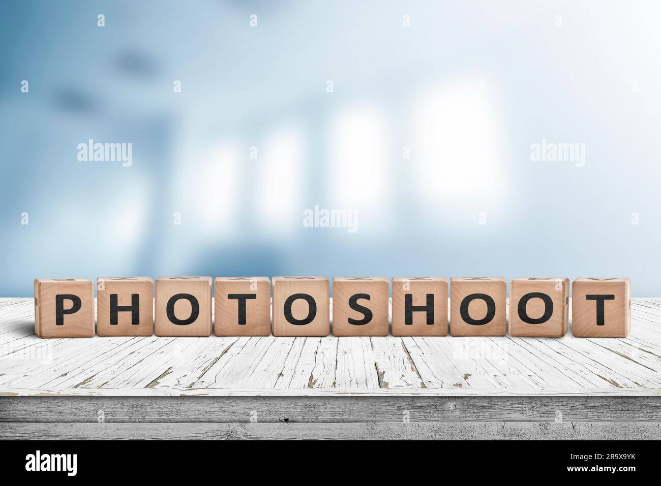 Photoshoot word sign on a wooden desk with a blurry background of a photo studio Stock Photo Alamy