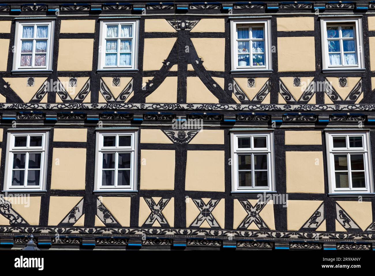 Details on magnificent half-timbered house with ornate wood carving, handicraft, facade richly decorated, Raiffeisen House, built 1679, Stad 44 Stock Photo