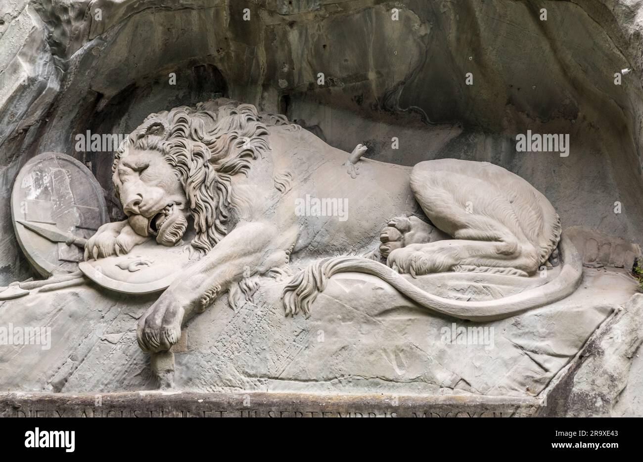 Nice close-up view of Lucerne's famous lion monument carved in stone. It is a landmark, a commemoration, a work of art and a memorial. It is dedicated... Stock Photo