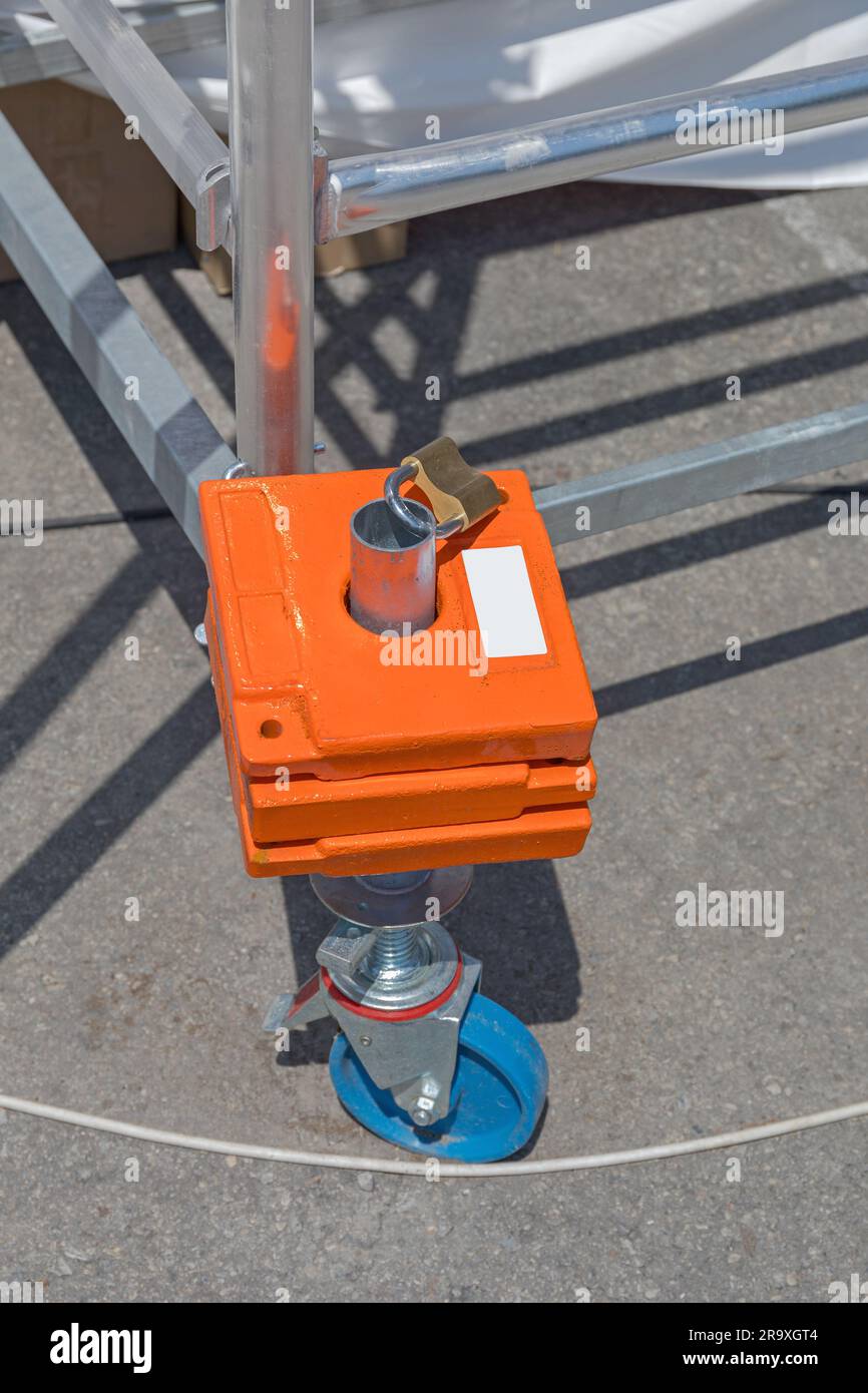 Ballast Weight With Padlock at Movable Scaffold Structure Construction