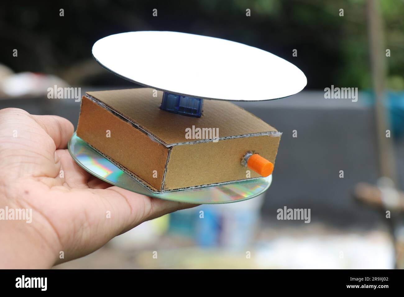Small motorized turntable used to capture videos and photos of the objects  held in the hand. Rotating display stand Stock Photo - Alamy