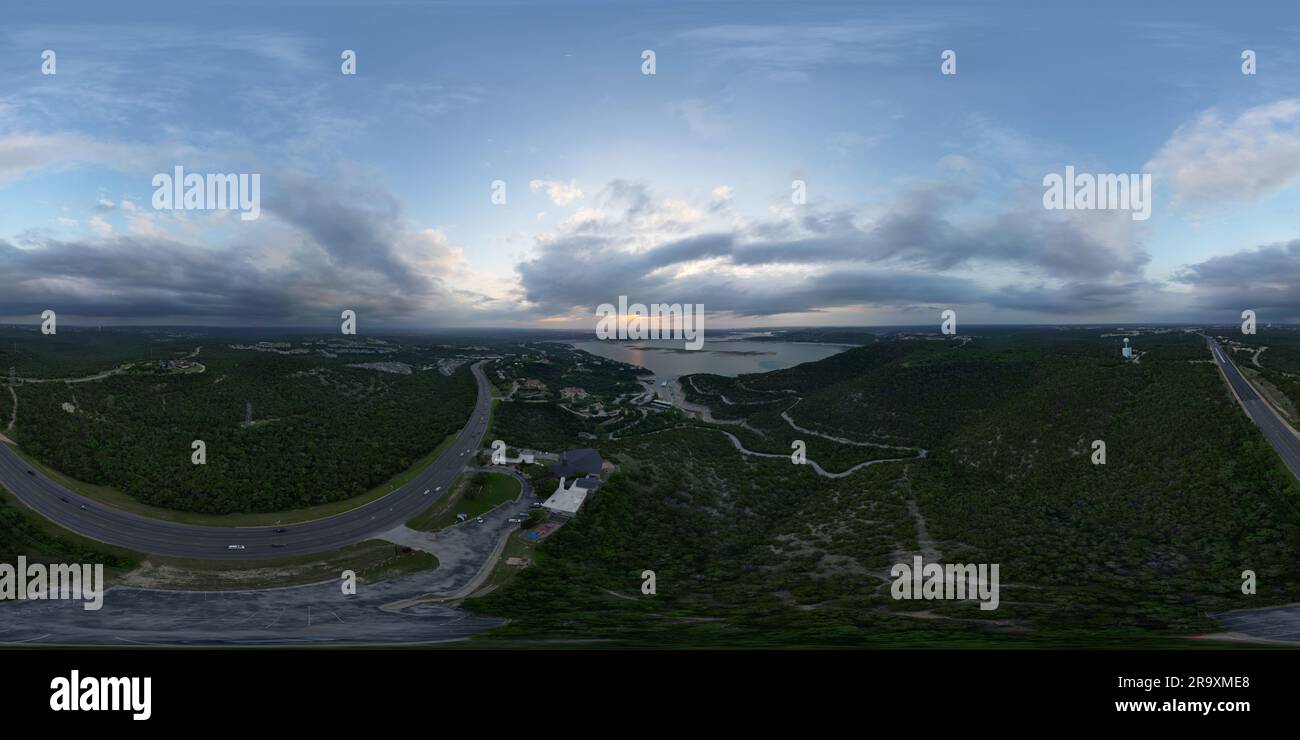 A scenic aerial view of a bustling cityscape and its winding roads ...