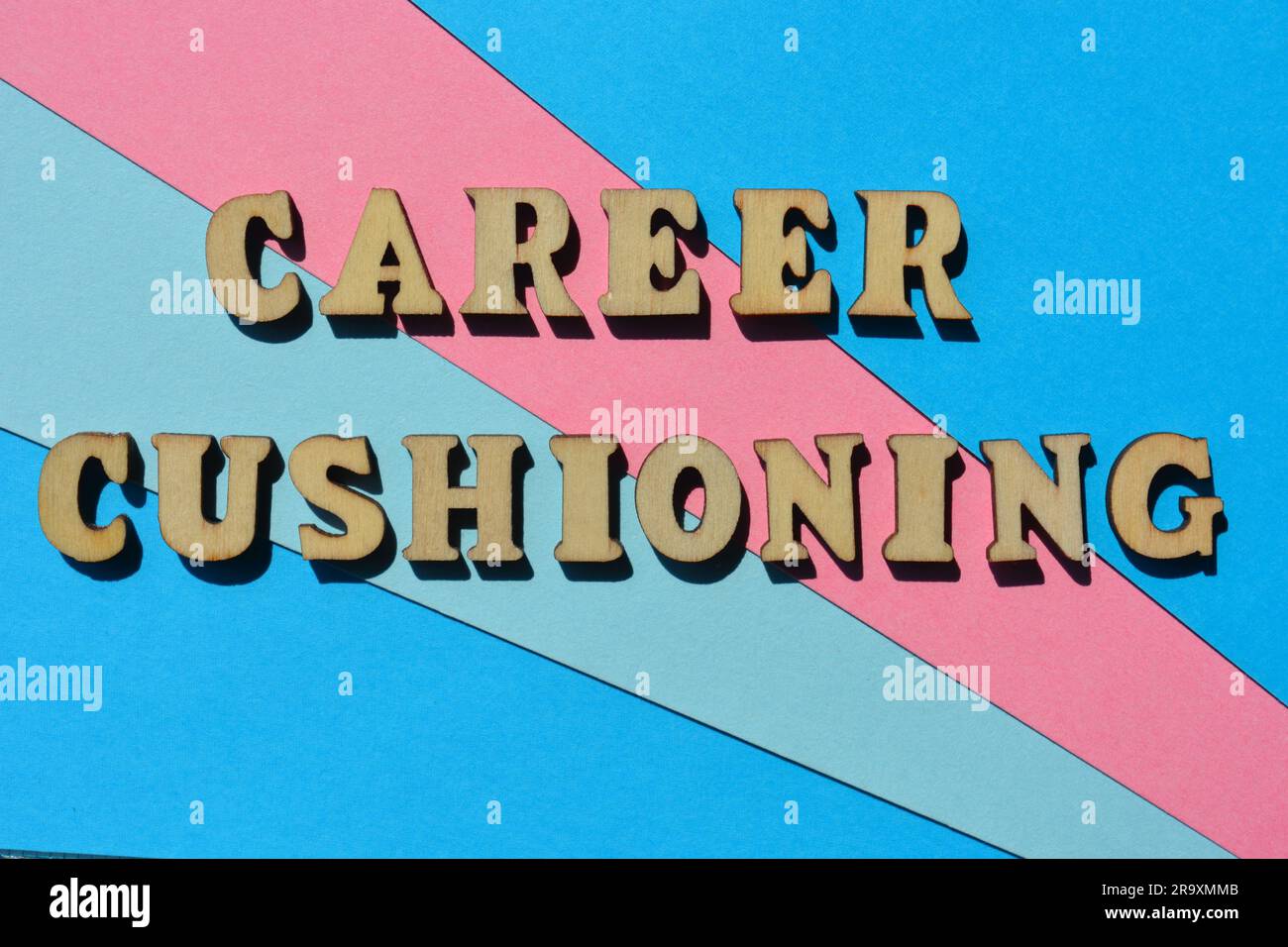 Career Cushioning, words in wooden alphabet letters isolated on colourful background, meaning to be proactive about your career prospects Stock Photo