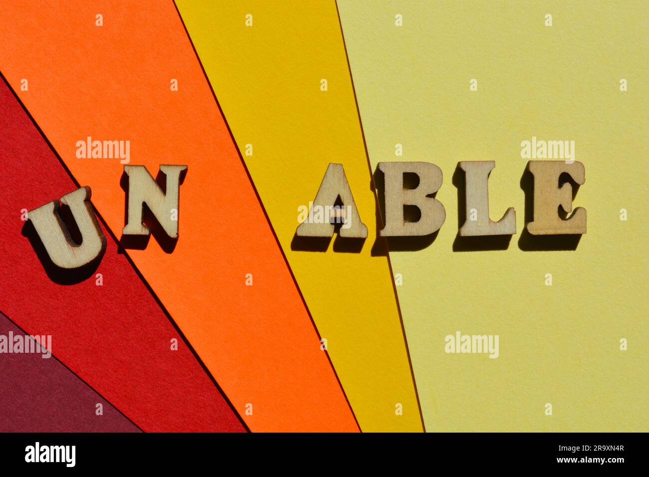 Able, Unable, words in wooden alphabet letters isolated on background