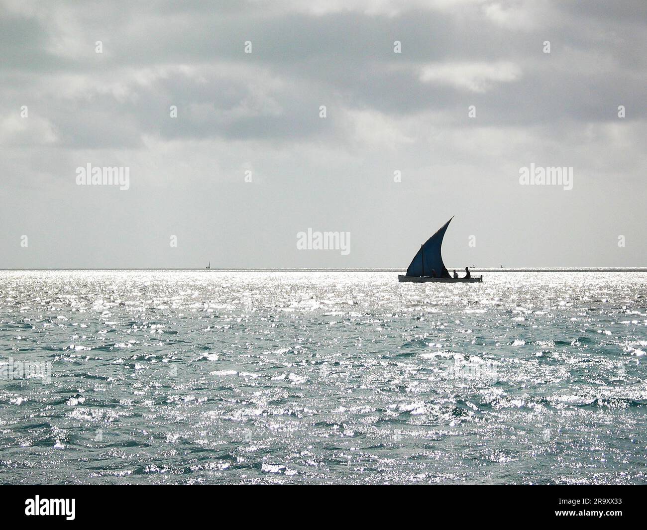 small fishing boat sailing canoe at sea Stock Photo