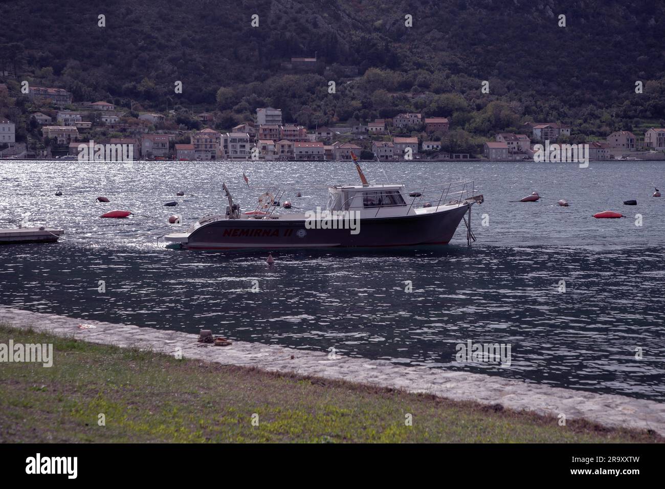 Montenegro, Apr 2023:  A boat belonging to the Institute of Marine Biology, Kotor (Institut za biologiju mora) anchored in the Bay of Kotor Stock Photo