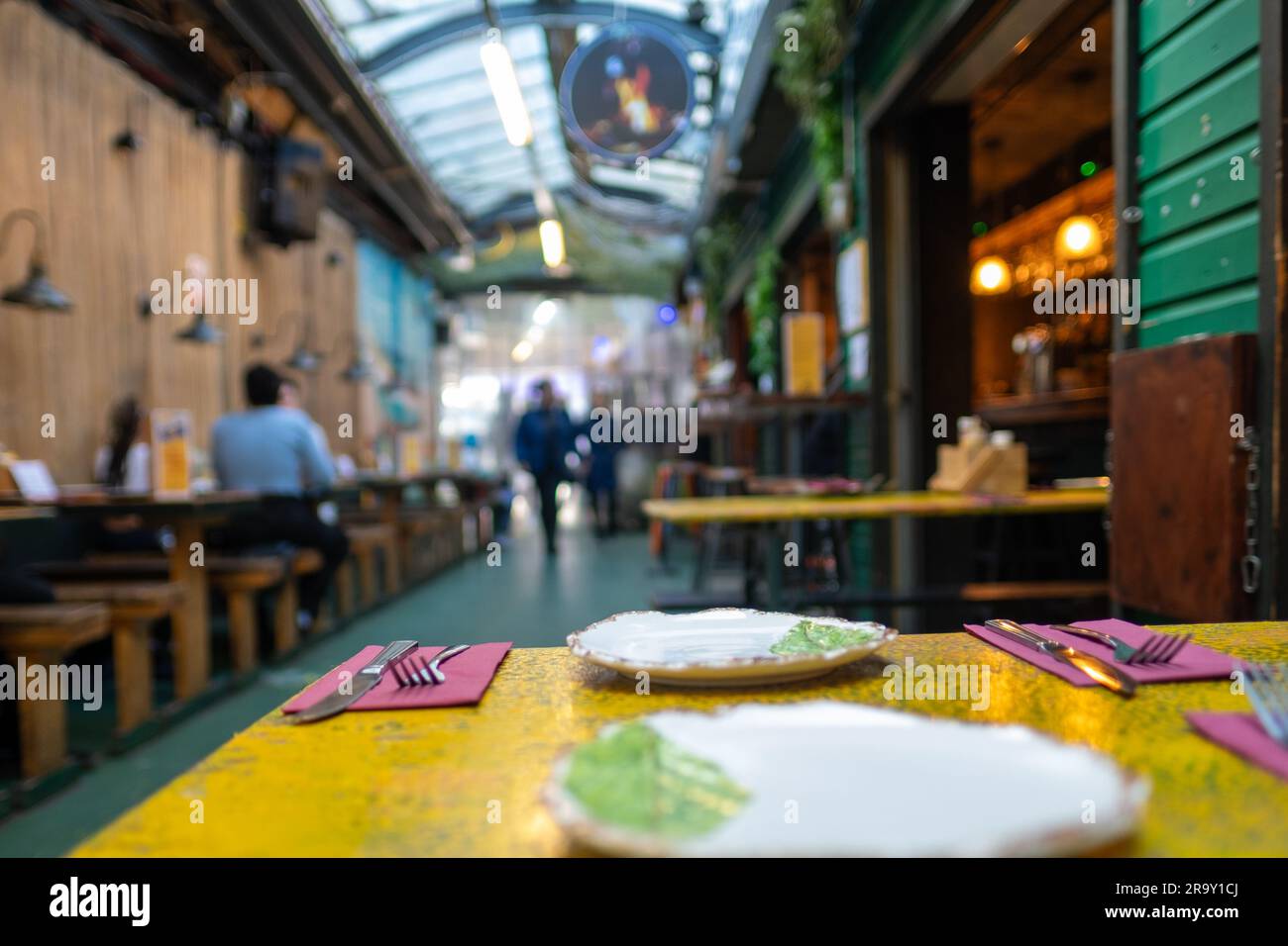 LONDON- APRIL,  2023: Tooting Market in South West London, an indoor market with many street food vendors and traders Stock Photo